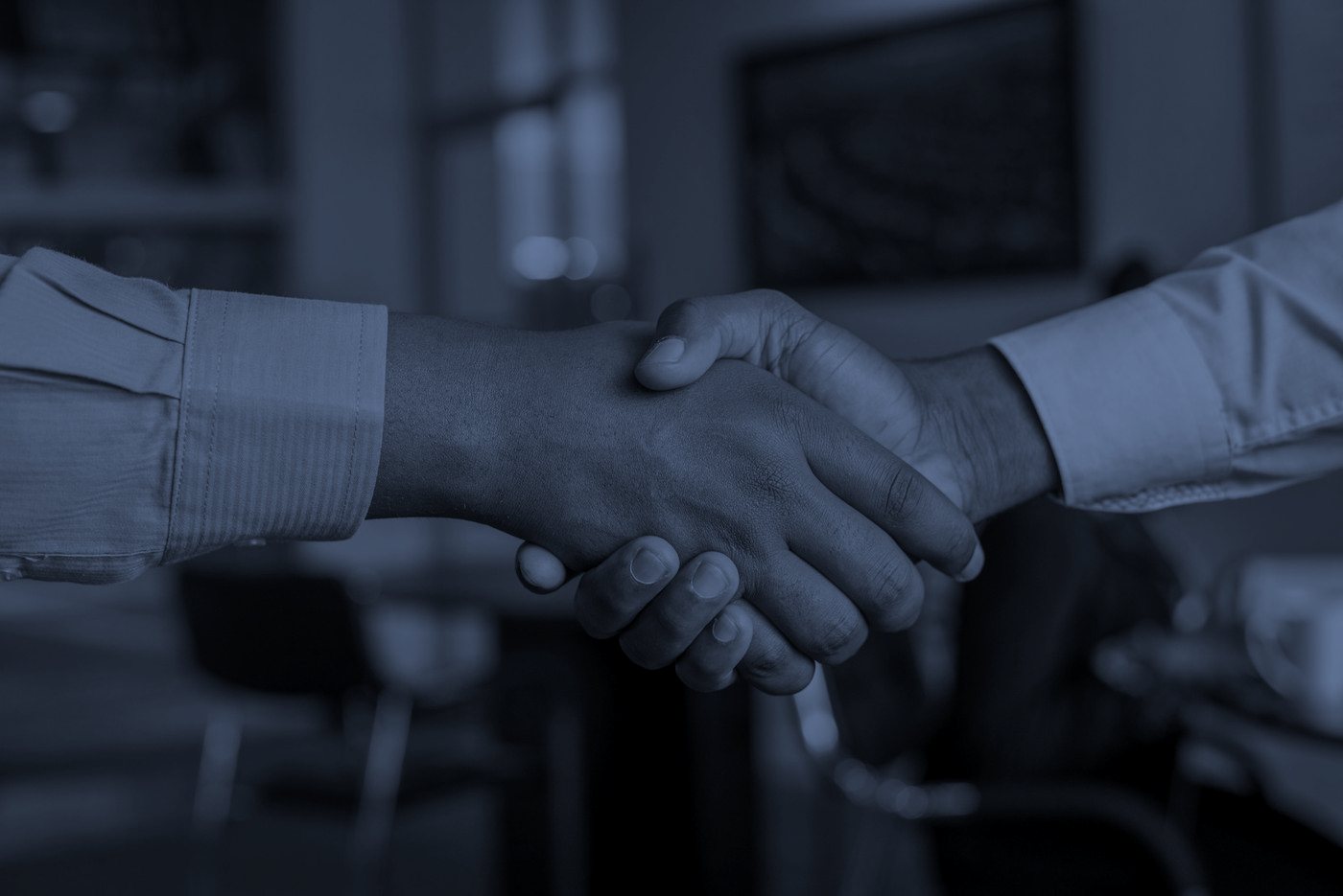 Partnership handshake at the Lonestar office